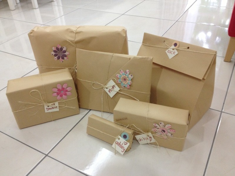 Christmas presents wrapped in brown paper and twine